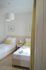 Postel nebo postele na pokoji v ubytování Kelly's Beach Apts