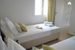 Postel nebo postele na pokoji v ubytování Kelly's Beach Apts