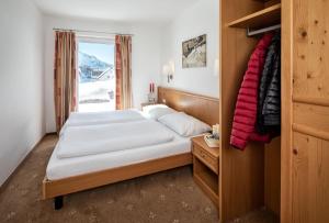 a hotel room with a bed and a window at Fewo-Obertauern-Steinadler in Obertauern