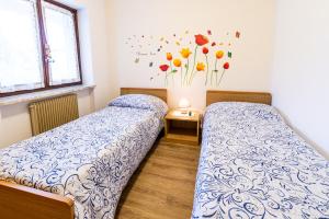 Postel nebo postele na pokoji v ubytování Casa Elisa Apartments