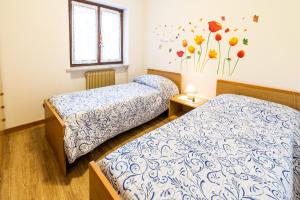 Postel nebo postele na pokoji v ubytování Casa Elisa Apartments