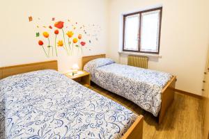 Postel nebo postele na pokoji v ubytování Casa Elisa Apartments