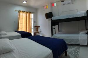 Letto o letti in una camera di L'Vanna Hotel