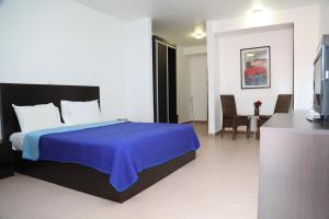 
A bed or beds in a room at Riviera Taouyah Hotel
