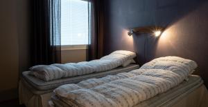 Vuode tai vuoteita majoituspaikassa Chalets UkkoHerra 1 & 2