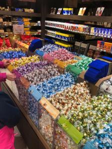 a woman standing in front of a display in a store at Apartment Lala in Interlaken