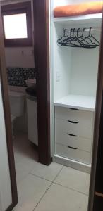 a bathroom with a white cabinet and a toilet at Flat 14 Pipa in Pipa +55 photos