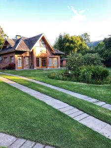 a walkway in front of a house at La Cabaña del 5 in San Carlos de Bariloche