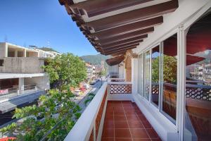 a balcony of a building with a view of a street at La Iguana Vallarta LGBT ADULTS ONLY - Romantic Zone - Party Clubbing Street in Puerto Vallarta