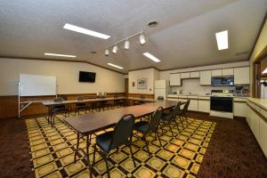 a conference room with a table and chairs in it at Motel 6 Minot, ND in Minot