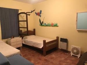 a bedroom with a bunk bed and a ladder at Baradero - La vida de campo a una hora del Obelisco! km142 R9 - las chapas casa de campo baradero in Baradero