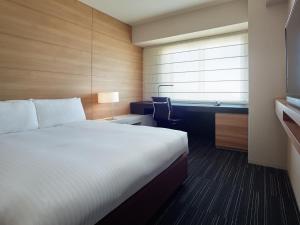 Postel nebo postele na pokoji v ubytování Mitsui Garden Hotel Ueno