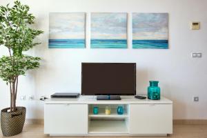 a white desk with a computer on top of it at Zurich 47 by homeprive in Denia