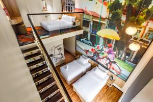 a room with a bunk bed and a staircase at Eastin Hotel Penang in Bayan Lepas
