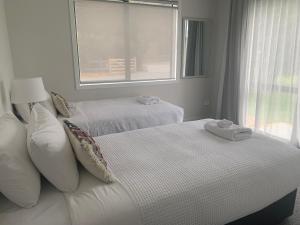 Postel nebo postele na pokoji v ubytování ValleyView Wanaka