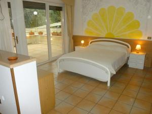 Postel nebo postele na pokoji v ubytování Hotel Vela Azzurra