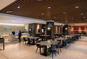 Restavracija oz. druge možnosti za prehrano v nastanitvi Holiday Inn Express Harbin Qunli, an IHG Hotel