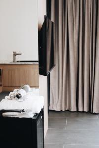 a kitchen with a sink and a table with a counter at Belly Inn Douliu in Douliu