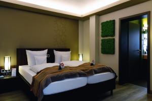 Ένα ή περισσότερα κρεβάτια σε δωμάτιο στο Villa Silva - Oberhof - Nebenhaus Berghotel Oberhof - nur Übernachtung