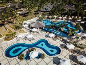 an aerial view of a pool at a resort at Warwick Le Lagon Resort & Spa, Vanuatu in Port Vila