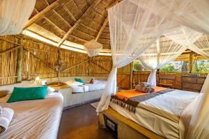 Ein Bett oder Betten in einem Zimmer der Unterkunft Umlani Bushcamp
