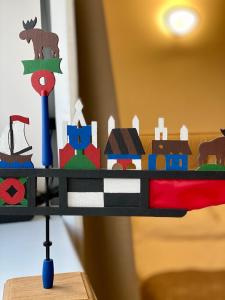 a wooden toy train on a wooden table at Nidos Palvė Ground Zero in Nida