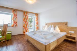 Posteľ alebo postele v izbe v ubytovaní Aparthotel am Reitecksee