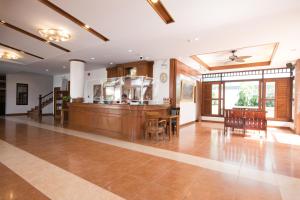 a large kitchen and dining room with a table and chairs at Sunview Place in Pattaya Central