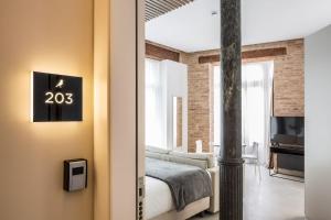 Mon Suites Benlliure客房内的一张或多张床位