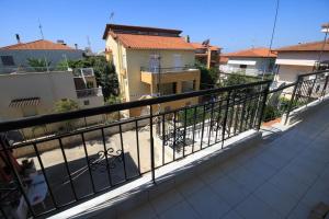 Balkón alebo terasa v ubytovaní Cozy apartment in Greece + 9 fotografií