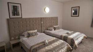 Voodi või voodid majutusasutuse Hotel Consul toas
