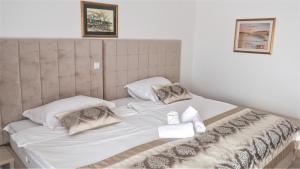 Voodi või voodid majutusasutuse Hotel Consul toas
