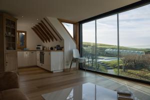 a kitchen with a large glass window with a view at Hurst Farm B&B in Crockham Hill