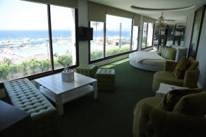 a large living room with a view of the ocean at Four Seasons Halat in Jbeil