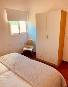 A bed or beds in a room at Apartamento La Real 2