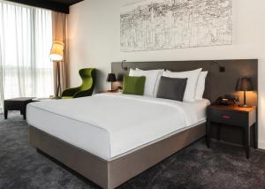 Voodi või voodid majutusasutuse Crowne Plaza Podgorica by IHG toas