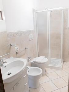 a bathroom with a sink and a toilet and a shower at Residence Gregory Filicudi in Filicudi