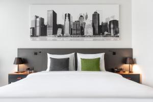 Voodi või voodid majutusasutuse Crowne Plaza Podgorica by IHG toas