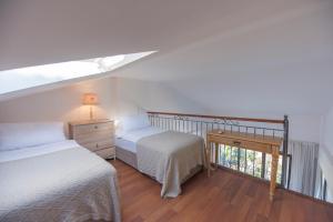 Кровать или кровати в номере Cocos The Club Solto