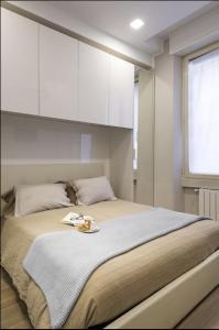 Un pat sau paturi într-o cameră la MG Orchidea