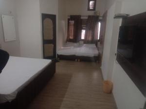 Cama o camas de una habitación en HOTEL JOGI GUEST HOUSE