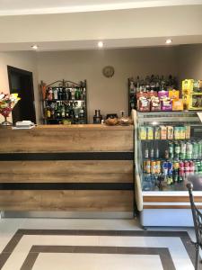 a store with a counter with a drink cooler at Solinaria Boutique Hotel in Sozopol