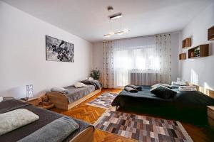 Łóżko lub łóżka w pokoju w obiekcie Apartamenty Bieszczady