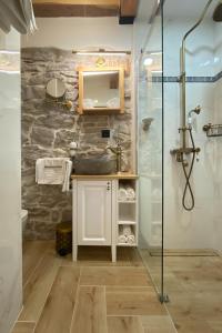 a bathroom with a sink and a shower at La Corte di Kate in Biograd na Moru