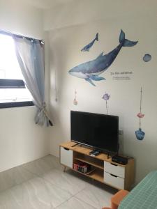 星動小屋民宿的电视和/或娱乐中心