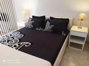 Un pat sau paturi într-o cameră la Apartamento Ferradura