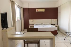Cama ou camas em um quarto em Apartamento Le Jardin