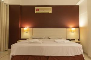 Cama ou camas em um quarto em Apartamento Le Jardin