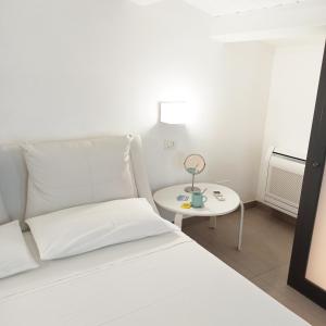 Katil atau katil-katil dalam bilik di Paolino Exclusive Rooms