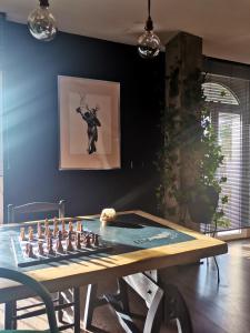 a dining room with a table with a chess game on it at LOFT "EL PARQUE" in Níjar